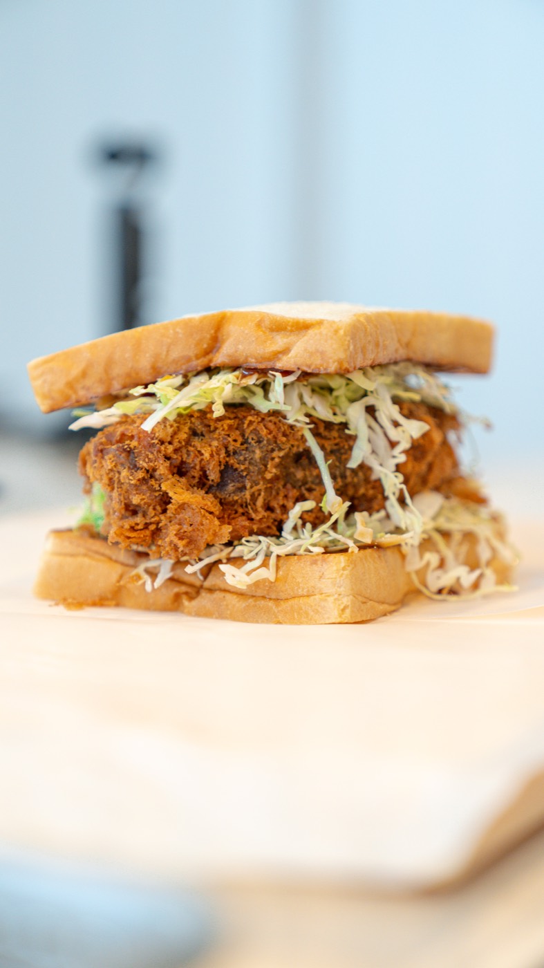 Kari Kari Sando katsu sando on shokupan with shredded cabbage and tonkatsu sauce